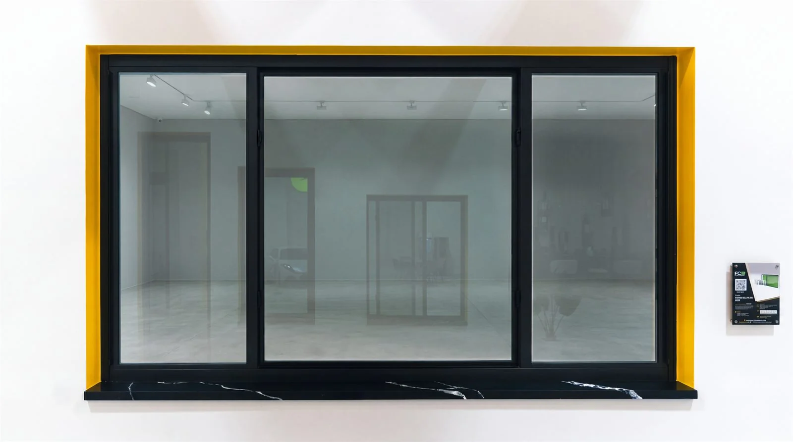 Impact-rated horizontal roller window on display with its specification placard